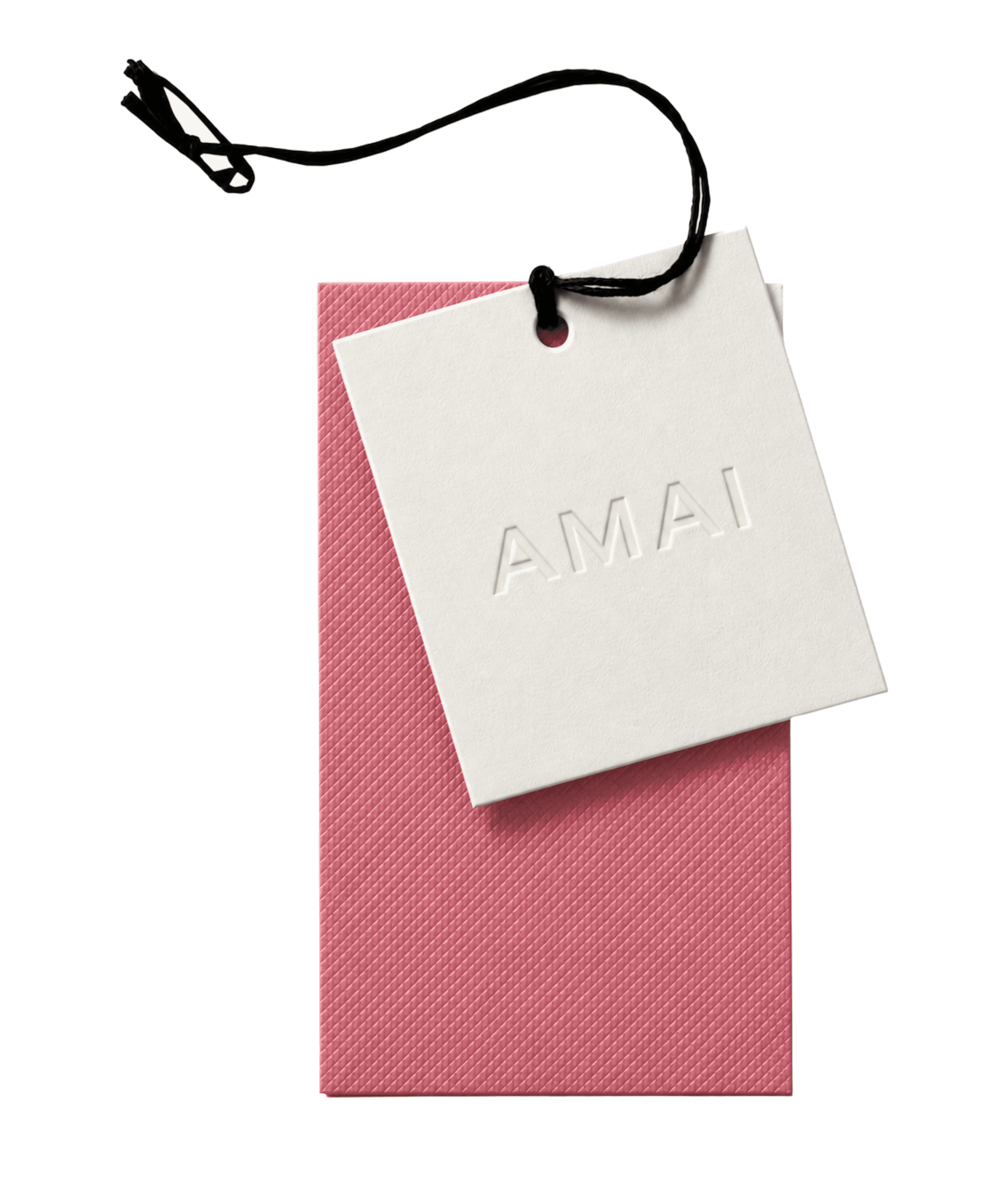 A cream AMAI hang tag on a black string, resting on a pink textured envelope.