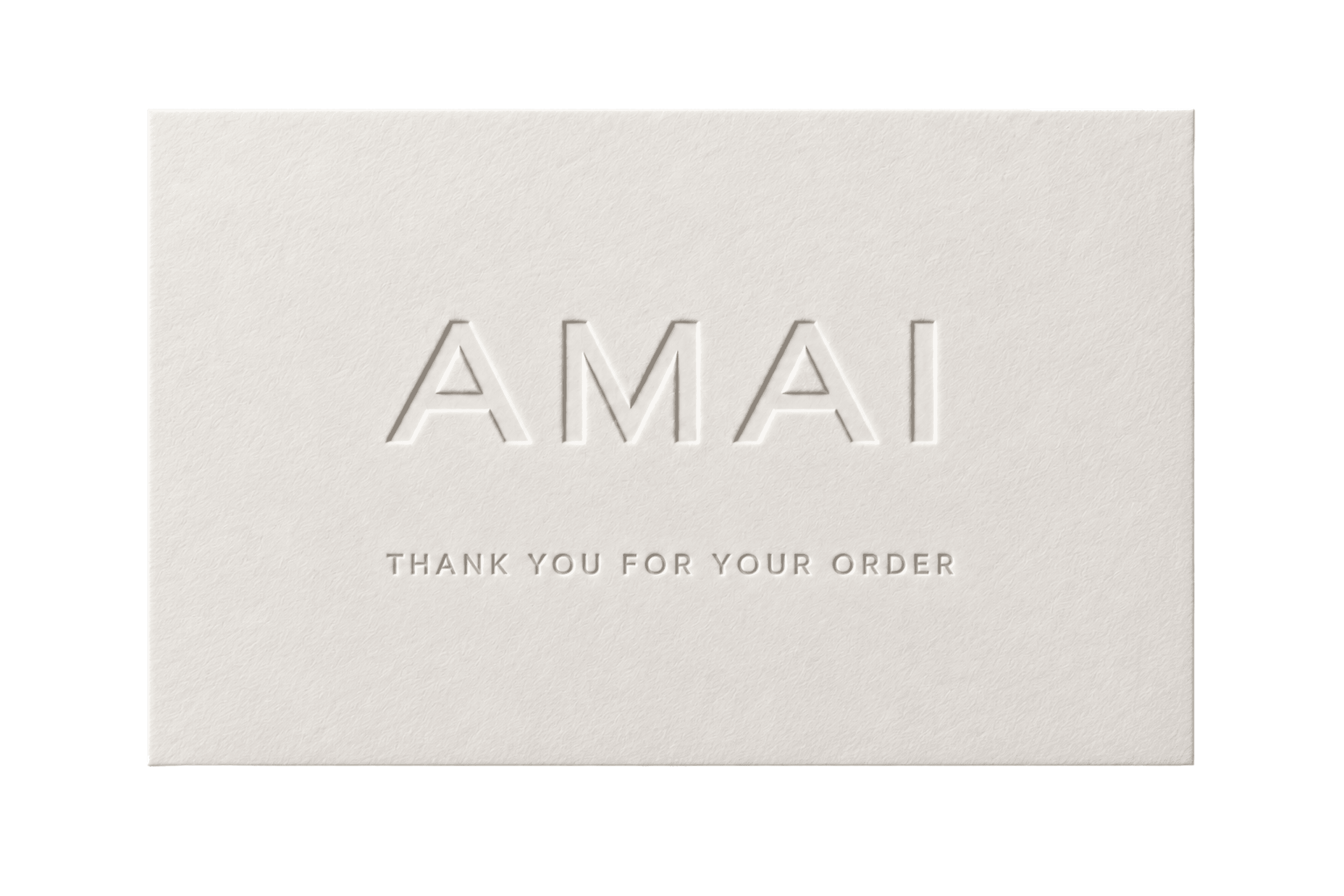 A cream AMAI card with the embossed wordmark and the line “thank you for your order”.